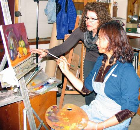 Warwick Atelier celebrates five years of individual art instruction Photo by Roger Gavan Award-winning artist Susan Hope Fogel working with Yong Byun, one of her student artists .