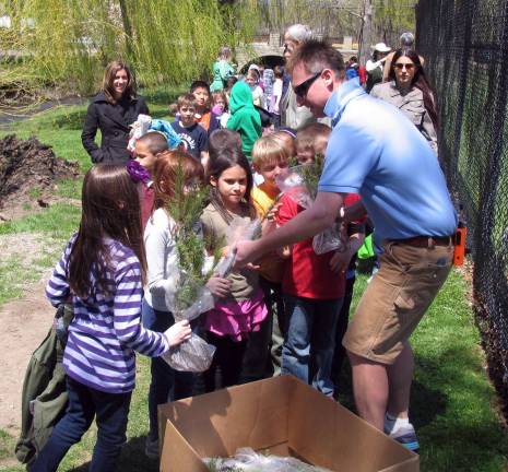 Village of Warwick celebrates Arbor Day Craig Wadeson from Wadesonís Home Center, handed out hundreds of tiny evergreens donated by his company.