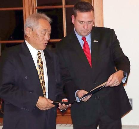 Orange County Executive Steven M. Neuhaus presents a Meritorious Service Award to Wayne Chan from the Monroe Volunteer Ambulance Corps back in November 2019. Chan will receive the 2023 NAEMT/Demers-Braun-Crestline-Medix EMT of the Year Award at the EMS World Expo on Sept. 20 in New Orleans. File photo.