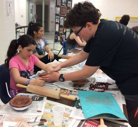 WVHS's Empty Bowls '18 raises more than $3,300 to fight local hunger A WVHS Empty Bowls Club member helps a young potter make a clay bowl.
