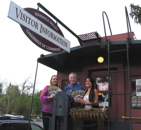 Chamber of Commerce distributes new Visitors Guide Michael Johndrow, executive director of the Warwick Valley Chamber of Commerce and Chamber employees Sarah Armand (left) and Jerrica Lavooy with copies now available of the redesigned Warwick Valley Guide for 2014-2015.