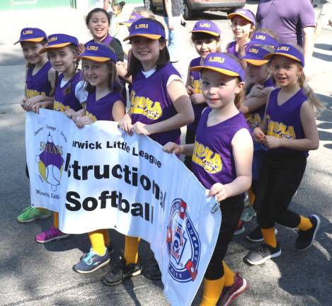Playball Thel parade headed down Main Street and then to the ball fields at Veterans Memorial Park.