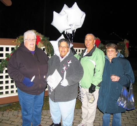 Warwick hosts vigil for Newton Photo by Roger Gavan Organizing a vigil during a busy holiday season and with no time to spare, however, was more of a task than she and her small ad hoc committee had anticipated. But they did it. From left, Pat Bezares, Vienna Aubert, Venus Miller and Maria Sfraga.
