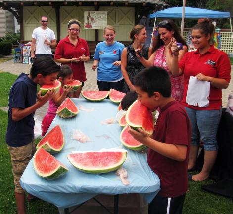 Annual Sidewalk Sale held under clear skies Photo by Roger Gavan The watermelon-eating contest, courtesy of Warwick ShopRite, was a fun event for both the participants and onlookers. These participants are in the age five to 10 category.