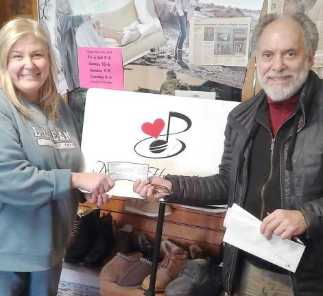 Barry Adelman with Christine Wanamaker of Chester, who won $3,000 in this year's Music for Humanity raffle. She bought her ticket on Nov. 9 at Outdoors of Chester.