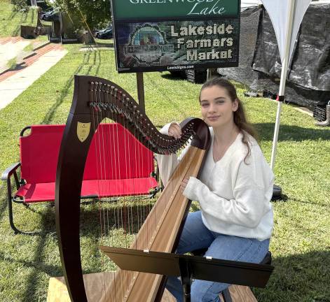 Mustard greens, mozzarella and live music Catherine Mahoney and her Lyon & Healy Ogden harp at the Lakeside Farmers Market.
