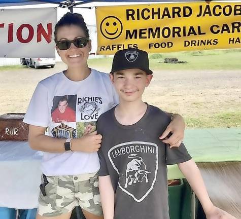 Katie RudyTomczak and Andrew Stephens, a pediatric cancer fighter and survivor from Middletown. This picture was taken at the Annual RJR Memorial Car Show in July.