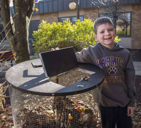 Superintendent’s Spotlight: Provided photo Daniel Lupkovich, a founding member of Sanfordville Elementary School’s Green Cub Club, and one of the school’s compost bins. Food scraps like apple cores and banana peels are collected and the resulting compost will nourish the school’s flower beds and gardens.