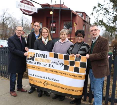 Total Account Ability celebrates 18 years of tax seasons Photo by Roger Gavan On Feb. 16, Members of the Warwick Valley Chamber of Commerce joined Natalia Fisher, her husband, Brian, and her mother, Lida Klenova, to celebrate her 18 years of tax seasons. From left, Chamber of Commerce Executive Director Michael Johndrow, Brian and Natalia Fisher, Lida Klenova, chamber past president Sherry Bukovcan and Warwick Supervisor Michael Sweeton.