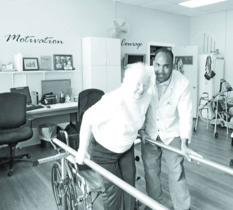 A champion in every way Elant resident Valerie Towsley is in physical therapy with Faizool Ali, physical therapy assistant.