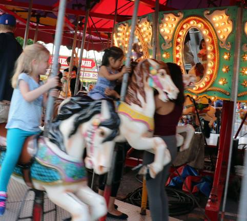 Let summer begin Children love the traditional Merry-Go-Round.