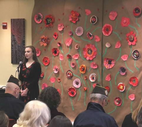 Albert Wisner Public Library hosts Remembering the Armistice Photos by Roger Gavan Fleur Kuhta read the famous poem by John McCrae, “In Flanders Field.”