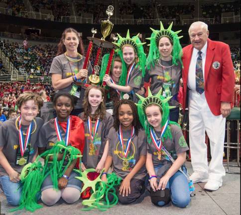 World champs X2 Photos by Maureen Westphal Members of the Sanfordville Team, standing from left to right, are: Coordinator Donna Denny, Alexa Keys, Olivia Holland, Coach Rekha Woods and Odyssey Founder Dr. Sam Micklus; and in front: Killian Bauman, Naa Korkoi Aryeetey, Ava Gell, Jay Seward and Julie Woods.