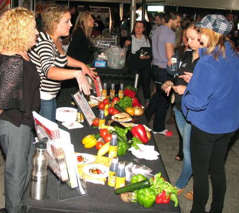 So tasty The huge tent accommodated 28 booths for local restaurants, wineries and other vendors as well as about 1,500 ticket holders who attended the popular annual event.