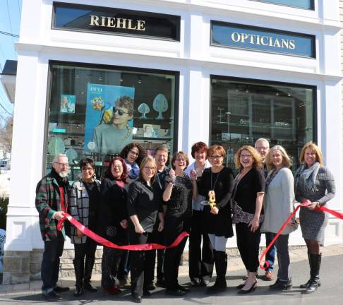 Riehle Opticians celebrates 30th anniversary Photo by Roger Gavan On March 21, Mayor Michael Newhard (far left) and members of the Warwick Valley Chamber of Commerce joined Corporate Representative Kathleen Greaney, Warwick Manager Lilly Beaty (center cutting ribbon) and her professional staff to celebrate the 30th anniversary of Riehle Opticians.