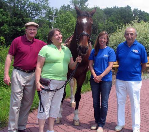 Winslow to host 39th anniversary Denim and Diamonds Gala Photo by Roger Gavan From left, honorees Dr. Edwin Wiley and his wife, Sally, ìTaz,î one of Winslowís horses, Winslow Executive Director Susan Ferro and Leo Kaytes, president of Winslowís Board of Directors.