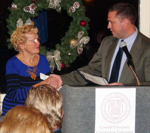 Vince Poloniak receives service award Chester Town Supervisor Steve Neuhaus presents the Cornell Cooperative Extensionís 2012 Lifetime Achievement Award to Tillie Gailie of Chester.