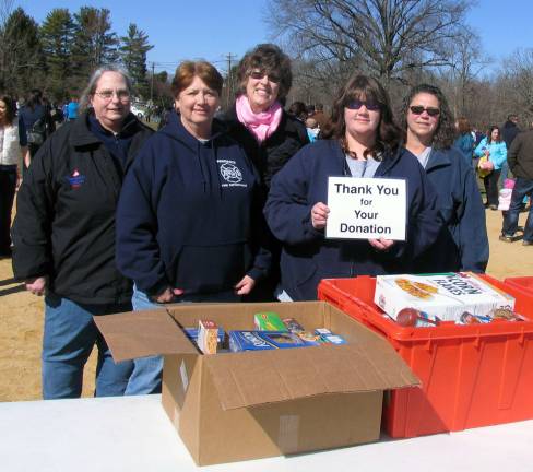 In search of the golden eggs New for this year was a food drive to help the Warwick Ecumenical Food Pantry. Participants were asked to bring a non-perishable food donation, which members of the Warwick Fire Department Auxiliary collected in boxes to be delivered to the Food Pantry office at the United Methodist Church. From left, Carol Schork, Mary Miles, Ellen Sinski, Heather Gardner and Angela Knuth.
