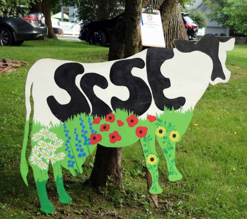 Celebrating Warwick's history In addition to a silent art auction, there were nine colorful “cows” in the park that were auctioned during the party or by online bidding. They were the creations of local students, representing each of the schools in the town of Warwick like this bovine by students from St. Stephen-St. Edward’s Elementary School.