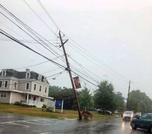 Severe thunderstorms cause havoc in Village of Warwick Photo by Terry Reilly Oakland Avenue at the corner of Third Street. Oakland Avnue was closed because of downed wires.