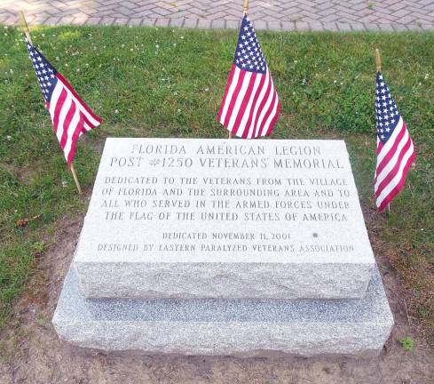 The student council members sell flags, such as pictured next to the monument marker, to be sponsored in the name of any veteran.