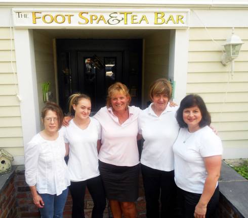Warwick Foot Spa and Tea Bar to celebrate first anniversary Owner Jo-Ann Daly (center) poses with members of her staff at the Warwick Foot Spa and Tea Bar.