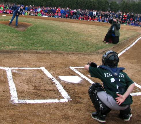 Warwick Little League celebrates opening day for 2014 baseball season At the conclusion of the event Town of Warwick Supervisor Michael Sweeton pitched the first baseball of the season to catcher Jake Dreizler.