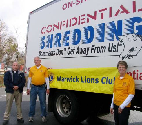 Warwick swept clean The Warwick Lions Club, for example, hosted a shredding truck, at its own expense, for the benefit of local residents. Approximately 10,000 pounds of documents were shredded. From left, Confidential Shredding driver Jim Palazzo with Lions George and Kathy McManus.