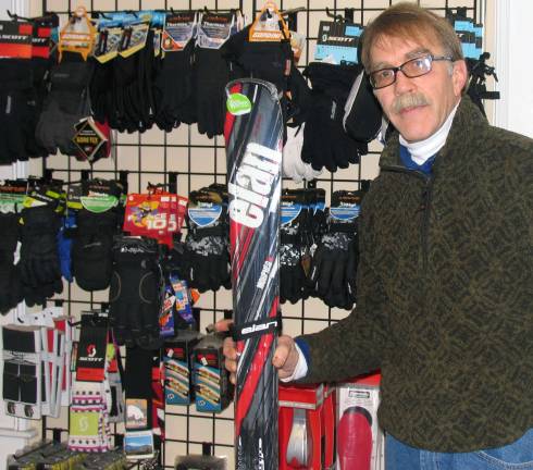 Miller Ski and Sport benefits from loyal customers and trend to shop locally Photo by Roger Gavan Bruce Miller with part of the store's selection of top quality winter sports clothing items and accessories with quality brand labels.