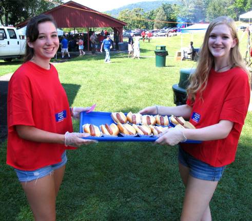 From left, Warwick Valley High School Juniors Molly Little and Vicki Wander volunteer to serve during the Annual Senior Picnic.