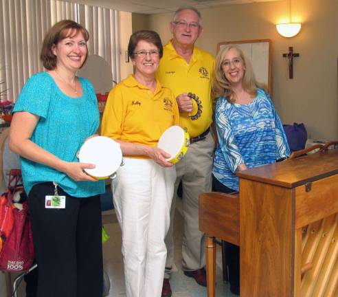 Photos provided by Bon Secours Charity Health System Thanks to a donation from the Warwick Lions Club and the efforts of Recreation Therapy Aide Jennifer Emm, each Wednesday Mount Alverno Center residents now have an opportunity to enjoy an evening of singing, laughing and playing instruments with Certified Music Therapist Melinda Burgard. From left, Emm, Warwick Lions Club representatives Kathy and George McManus and Burgard.