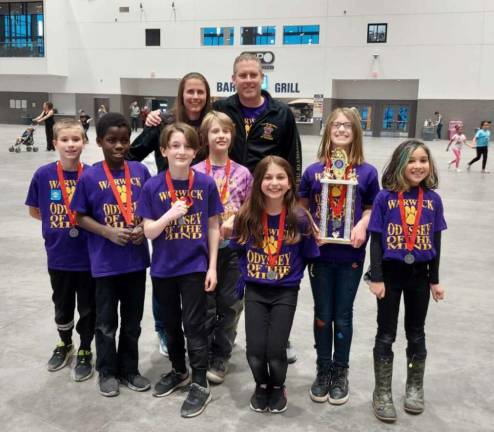 The Sanfordville Elementary School Odyssey of the Mind team took second place and qualified for World Finals in Iowa. Front row from left to right John Powers, Max Powers, Blake Harrison, Eamonn Byrne, Angelica Costanza, Madison Candia and Lilah Diaz. Back row: Heidi Powers and Dan Powers. Photo provided.