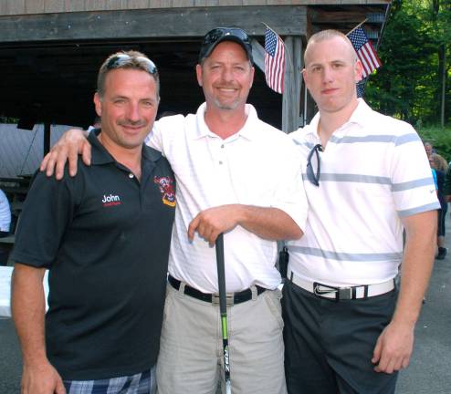 A good time was had by many Photo by Ed Bailey From left to right, pictured here Greenwood Lake Fire Chief John Rader, Jeff Sarine, winner of this yearís GWL Fire Departmentís golf tournament, and Mike Dunlop, the tournamnent chairman.
