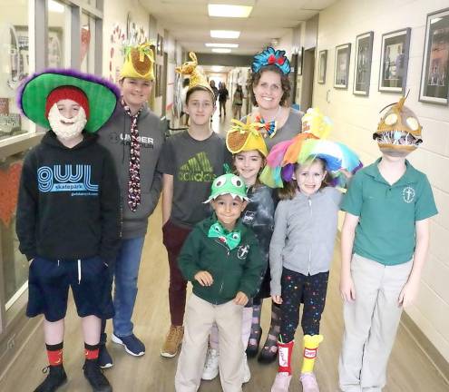 Some of the students pose with St. Stephen – St. Edward Elementary School Principal Bethany Negersmith during Crazy Hat, Socks and Tie Day.