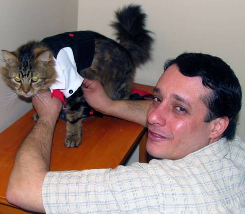 Purr-fect ending Animal Control Officer Tom Neely, who was the Best Man, grooms the groom shortly before the ceremony.