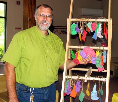 Warwick United Methodist Church pastor reassigned Photo by Roger Gavan The Rev. Chris Yount, pastor of Warwickís United Methodist Church, alongside a display of various tasks to be performed by participants in the churchís Go and Do Camp.
