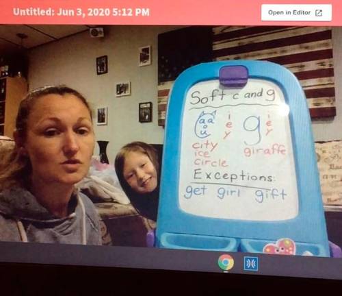 There’s nothing remote about remote teaching with a kindergartener by your side <b>Dana Ashley teaching her class remotely while her daughter, Clare, makes an appearance. </b>