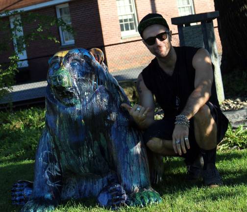 Cosmo the bear has landed "Cosmo" the bear is a three-dimensional painted sculpture by one of the Village of Warwick’s Artists in Residence, Elliot J. Belokostolsky, who said Cosmo represents the freedom of self-expression and devours fear of creativity.