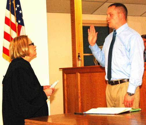 My turn Jesse Dwyer 'A wake up call' for Greenwood Lake Photo By Ed Bailey Jesse Dwyer takes the oath of office, administered by Judge Nancy DeAngelo, as mayor of the Village of Greenwood Lake prior to Monday eveningþÄôs village board meeting.