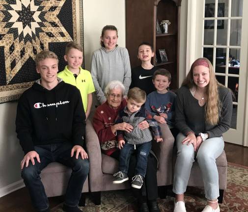 Theresa (Folino) Cassanite is surrounded by her two great granddaughters and five great grandsons at her 95th birthday celebration.