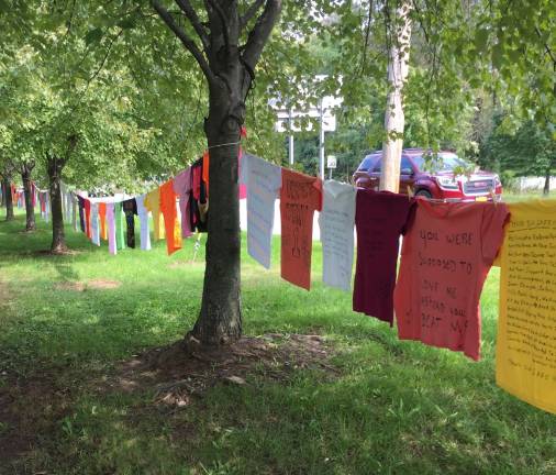 Clothesline Project raises awareness of domestic violence T-shirts made to honor survivors of domestic violence were on display in at the Orange County Government Center in Goshen in recognition of October as Domestic Violence Awareness Month. One in four women will be the victim of domestic violence at some point in her lifetime, says Kellyann Kostyal-Larrier, executive director of Safe Homes of Orange County. “Survivors and victim voices should lead all of our communities around awareness and the power of believing victims,” she said. “The clothesline display continues to shout from the fabric on which the words are written, the impact abusers have on their victims, children, and communities.