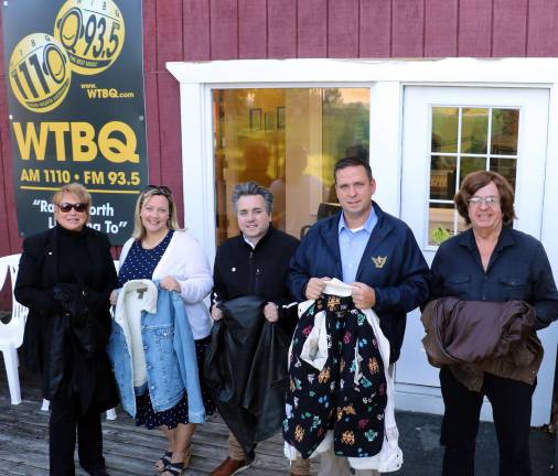 WTBQ launches annual coat drive for needy families Photo by Roger Gavan From left, WTBQ Station Manager Taylor Sterling, HONOR Chief of Staff Liz Schmidt and Executive Director Chris Molinelli, Orange County Executive Director Steve Neuhaus and WTBQ owner Frank Truatt launch the “Share the warmth” coat drive.