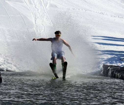 Mt. Peter holds March Spring Rally with Wacky Water Skiing Contest Photos by Roger Gavan While crowds of onlookers kept a safe distance to the side of the trough, the contestants transitioned from snow to water attempting to make it all the way across the full length of the trough, recovering back on snow.