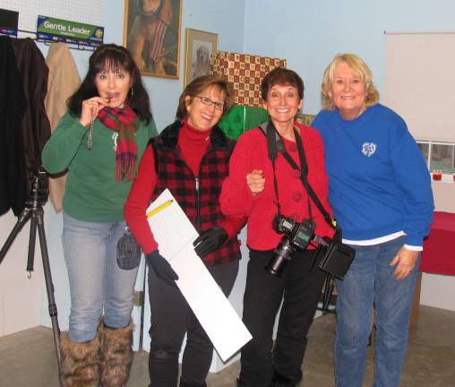 From left, Suzyn Barron, president of the Warwick Valley Humane Society, volunteer Donna Faustini, professional pet photographer Chris Babicke and Humane Society Vice President Celia Ross made the pet photos with Santa happen.