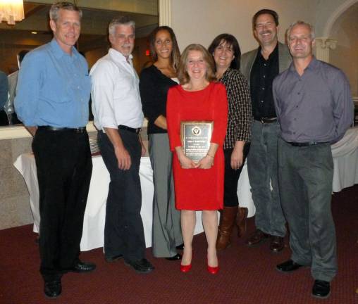 ‘It will take at least two if not three people to fill Theresa’s cleats’ Provided photo Board members of the Warwick Soccer Club Peter Greibesland, Craig Shields, Sharon Mansueto, Christine Bodeker, Garrett Durland and Rob Horn accompanied Volunteer of the Year Theresa Mandracchia to the East Hudson Youth Soccer LeagueþÄôs Award Dinner last Saturday.