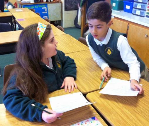 ‘Coins for Change’ Tuxedo Park School third-graders Courtney Swingle of Warwick and Serdar Kaltalioglu of Newburgh helped their class raise $1,351 in a coin drive to buy books for children who have none in Africa.