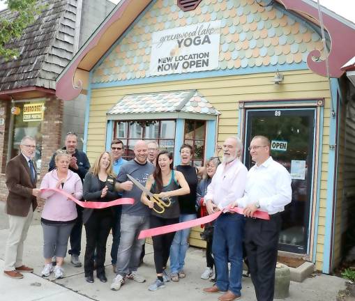 Greenwood Lake Yoga prides itself as being a community-focused yoga studio offering over a dozen weekly classes for beginners to experts alike. This past fall Town of Warwick Supervisor Michael Sweeton (left), Greenwood Lake Mayor Jesse Dwyer (right) and members of the Warwick Valley and Greenwood Lake Chambers of Commerce joined owners Sarah Snider and Sean Beach (center) to celebrate the grand opening of their new facility at 89 Windermere Ave. For additional information or to sign up for their newsletter, visit www.greenwoodlakeyoga.com or call 477-5322.