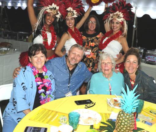 The professional hula dancers visited each table to pose for photographs. Pictured here are from left, Fran Sinclair, Paul Bailey, Virginia Mazza and Eileen Deehan.