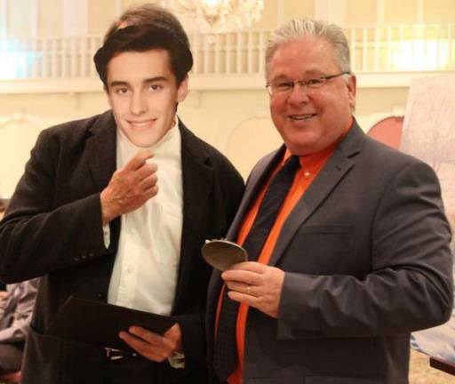 Orange-Ulster BOCES honors regional arts and humanities achievement Max Von der Horst’s father accepts the award from William J. Hecht, OU BOCES district superintendent.
