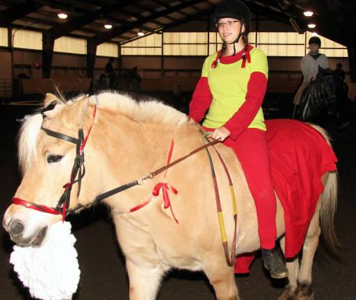 Winslow hosts Halloween horse show Photo by Roger Gavan Lauren Sternberg with Santa Claus.